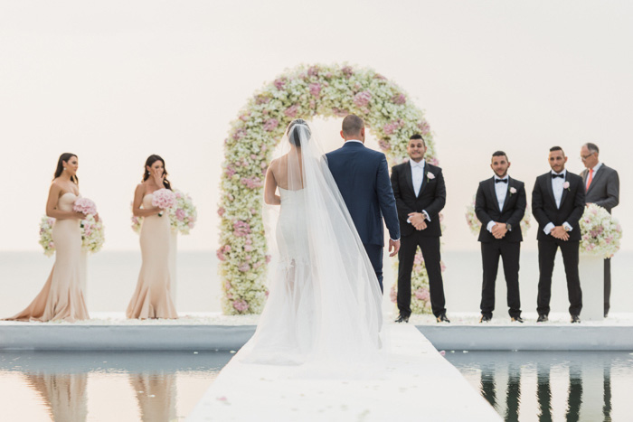 bride walking down the aisle from behind