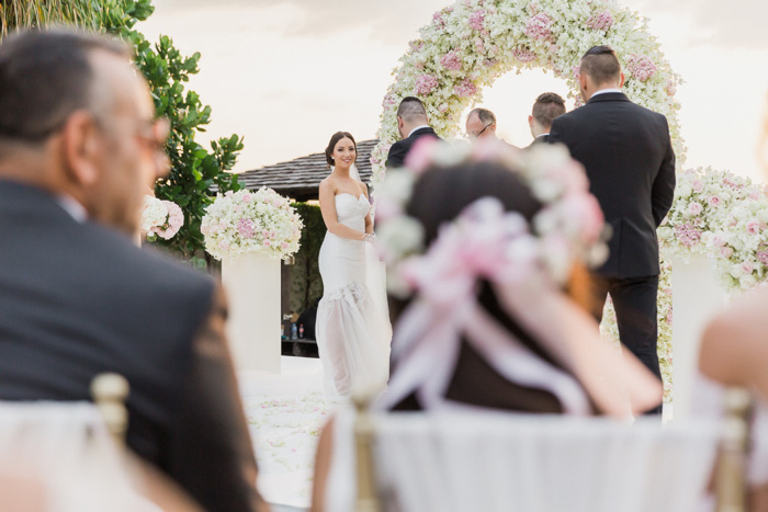 bride looking over at daughter during ceremony