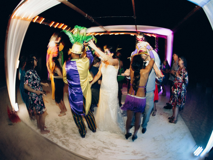 wedding guests dancing on the beach