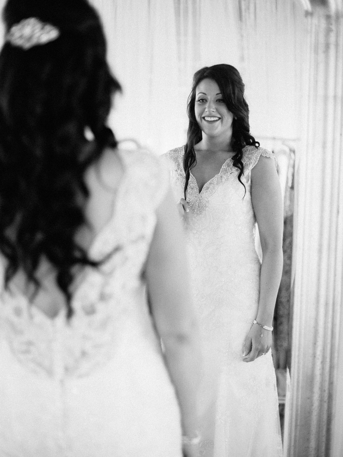 bride looking in the mirror 