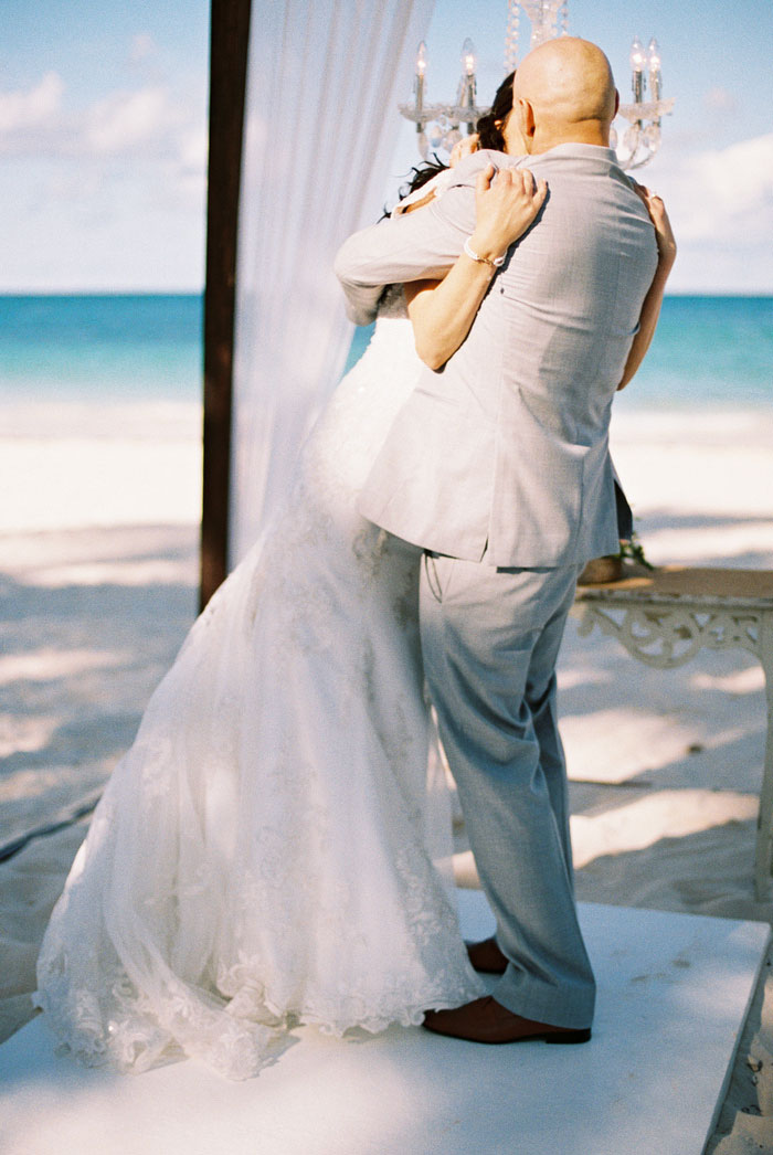 bride and groom first kiss