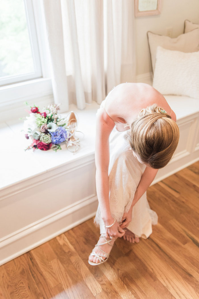 bride putting on shoes