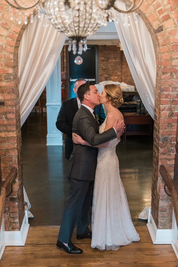 bride and groom first kiss