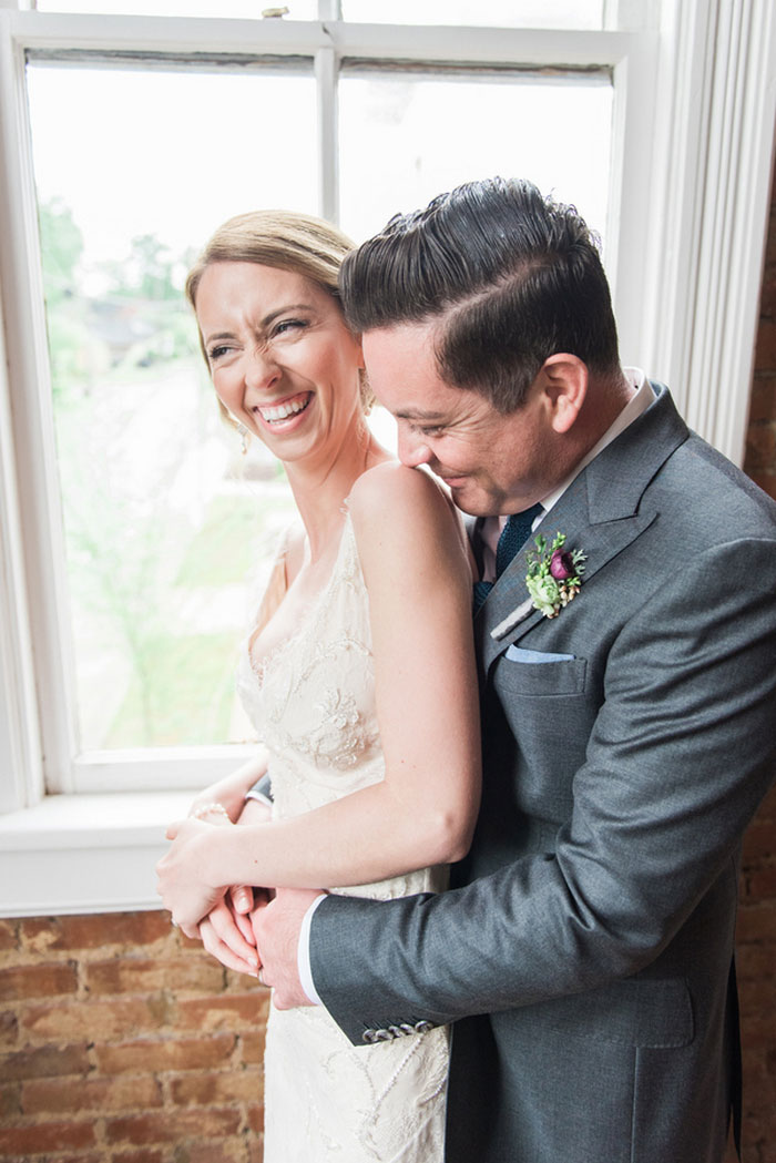 bride and groom laughing 