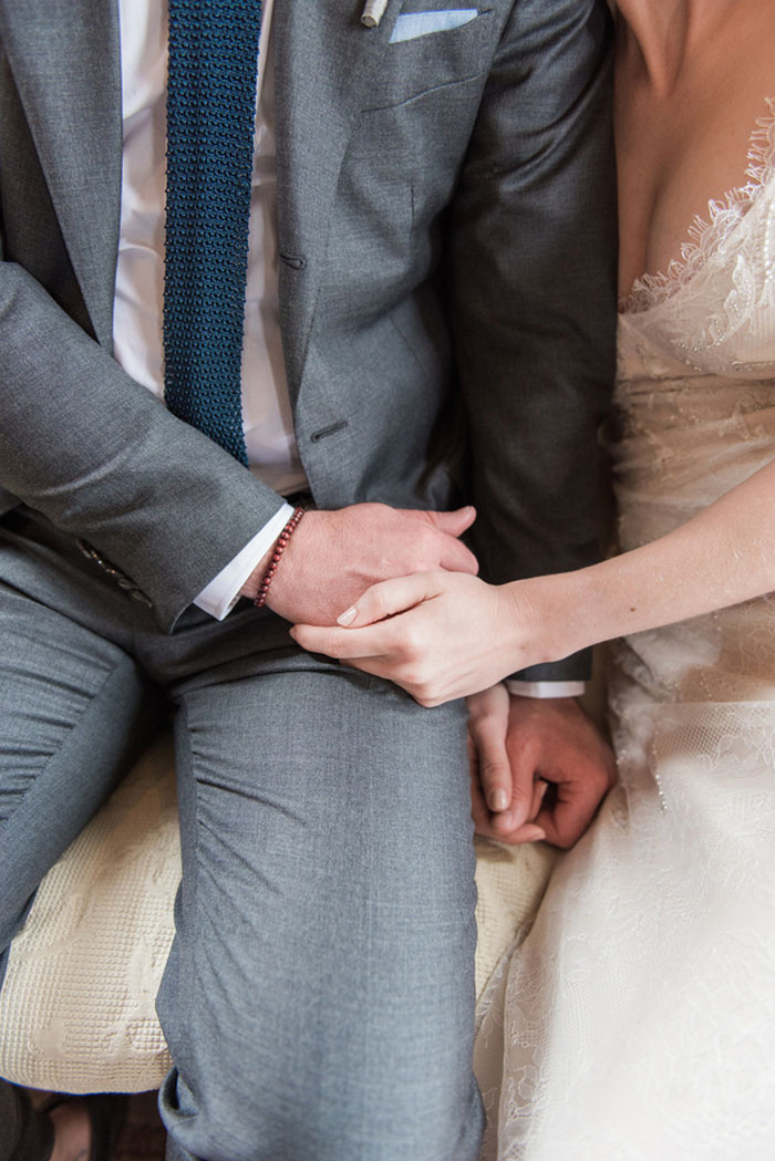 brie and groom holding hands